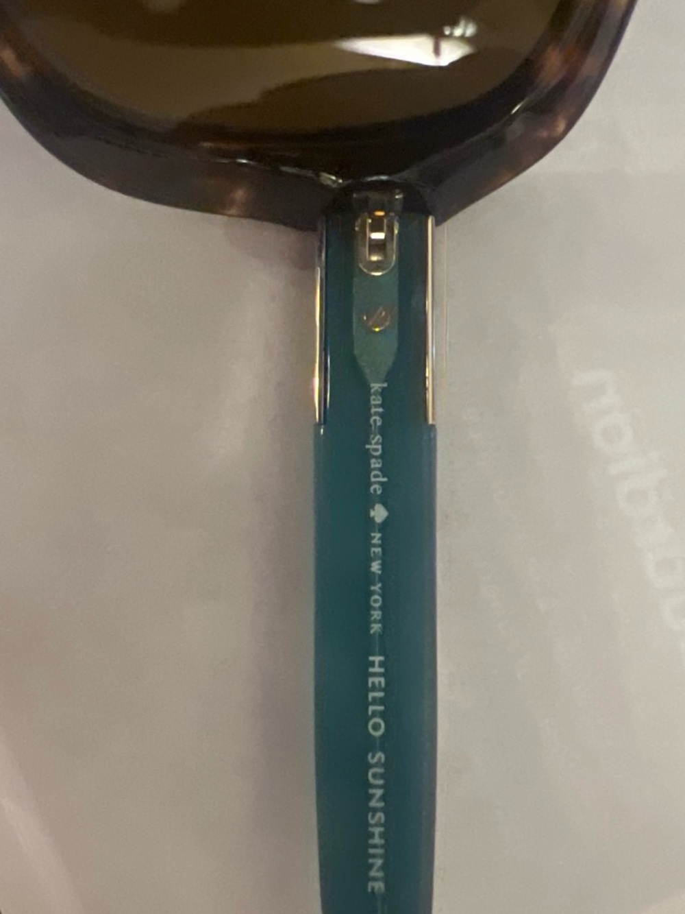 kate spade teal sunglasses arm with gold accents